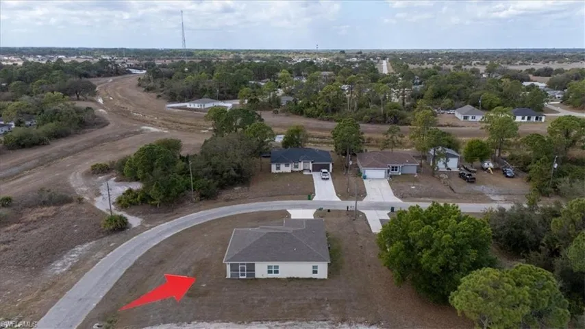 View of property location with nearby suburban area