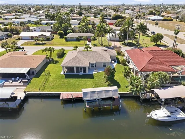 Aerial perspective of suburban area with a nearby body of water
