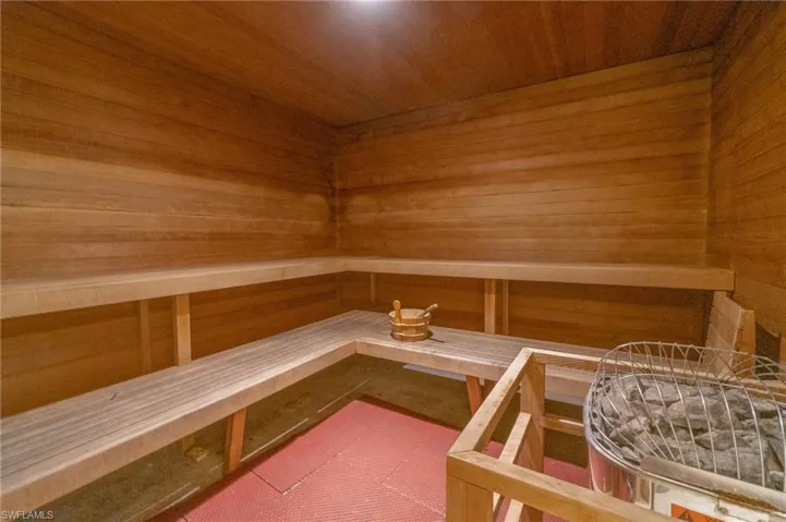 View of sauna featuring wood walls and wood ceiling
