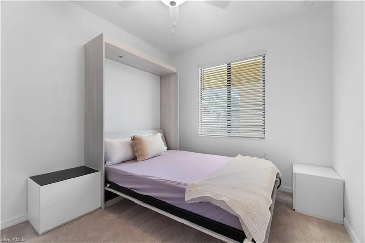 Bedroom featuring carpet flooring and ceiling fan