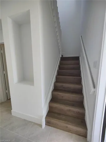Stairway with tile patterned flooring