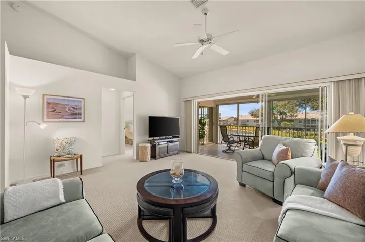 Light-filled living area with soaring vaulted ceilings and open-concept design.