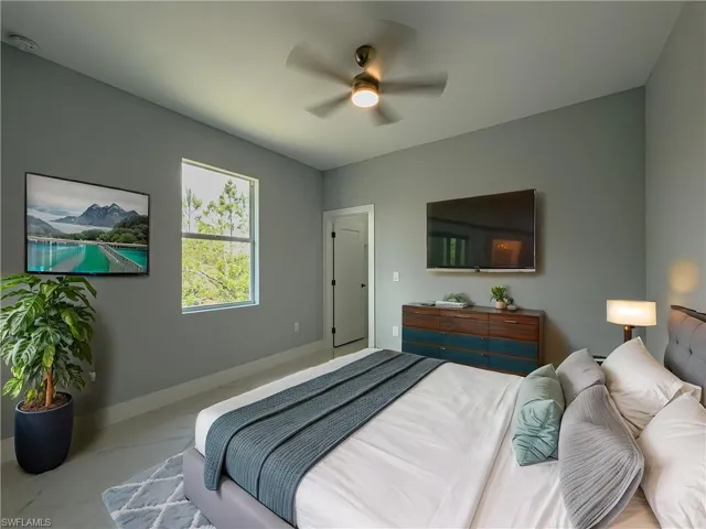 3rd Bedroom featuring baseboards, ceiling fan, and marble finish floor