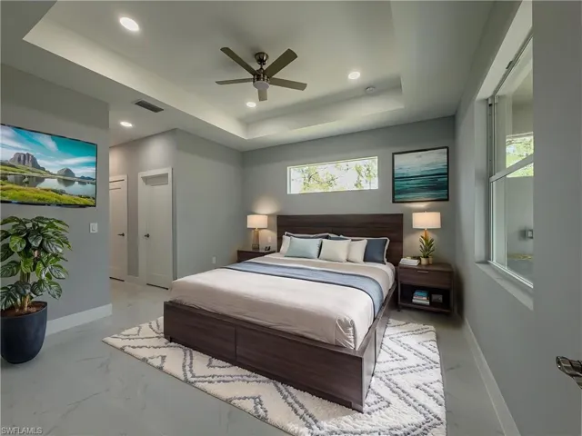 Master Bedrrom with visible vents, recessed lighting, a raised ceiling, and baseboards