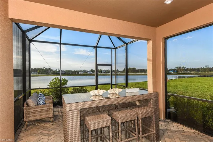 Sunroom with a water view and plenty of natural light