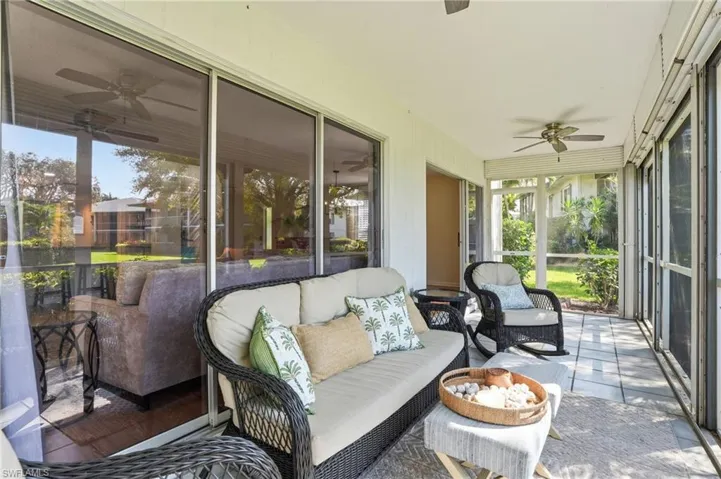 Lanai exits to the green space to the pool area