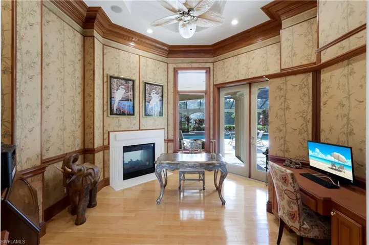 Unique Asian inspired office w/rich, layered crown molding, stone gas fireplace, 2 sets of double doors plus bamboo wood flooring!