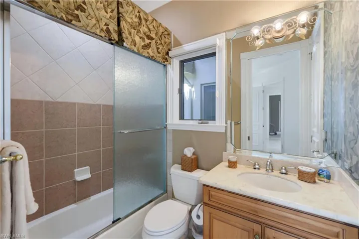 Guest suite full bath doubles as west wing powder bath