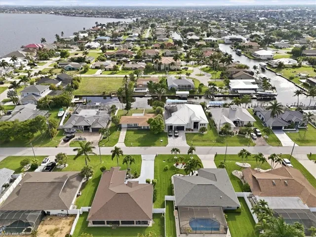 Canal-front property featuring a private boat dock and direct water access