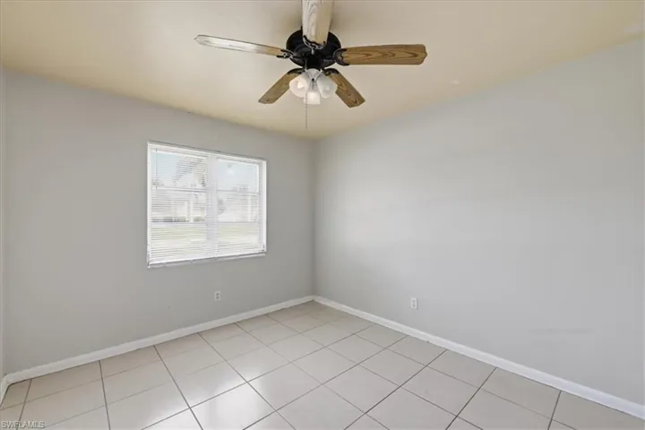 Room with light grey walls and a contrasting ceiling