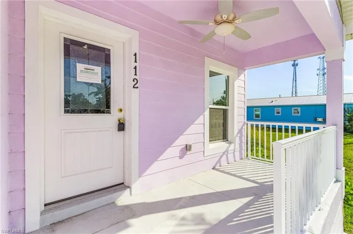 Entrance to property with a ceiling fan