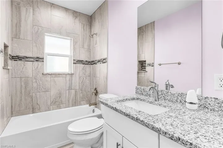 Full bathroom featuring vanity and bathtub / shower combination