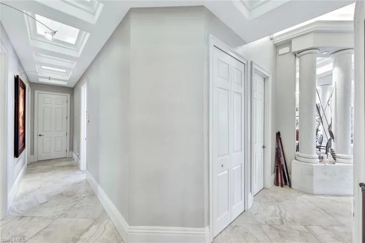 Hallway to 3 guest suites including the gym. 12- 14' foot coffered backlit ceilings - very dramatic.