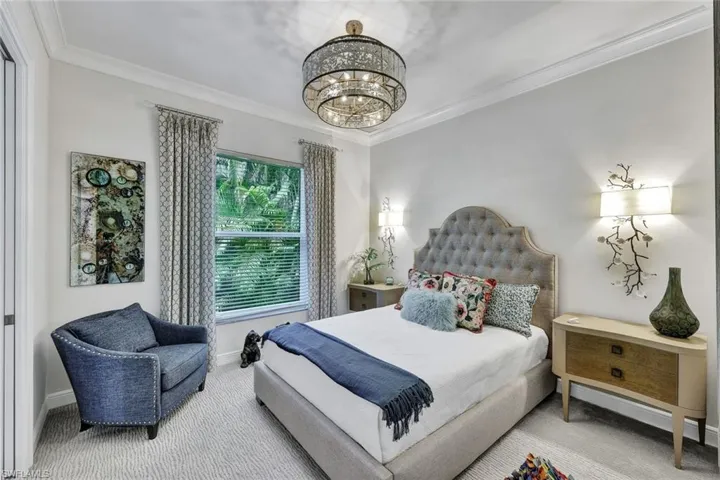 Guest suite #3 features beautiful sconces, designer lighting - tastefully decorated with walk in closet.