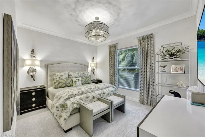 Guest suite #2 Beautiful side sconces, designer lighting button TV monitor and tastefully furnished with walk in closet.