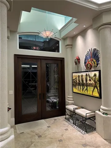 Dramatic entry with double impact glass doors.