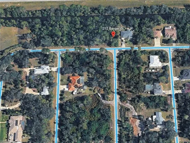 Aerial shot - nice neighborhood of large homes.