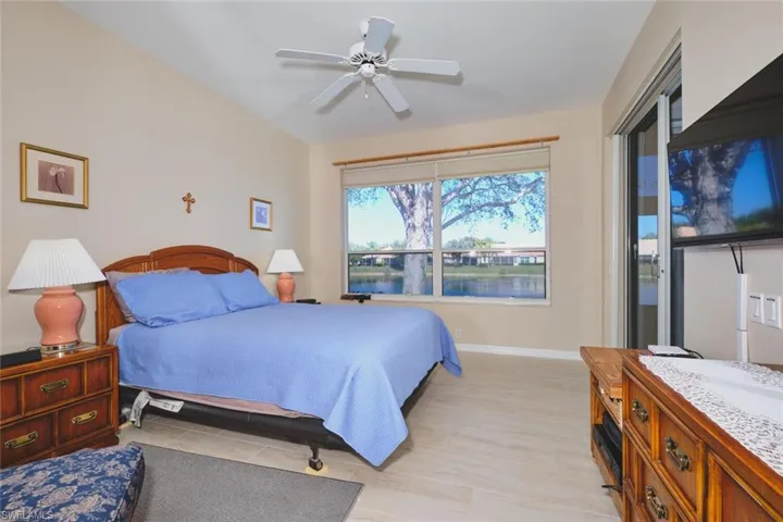 Bedroom featuring ceiling fan and access to outside