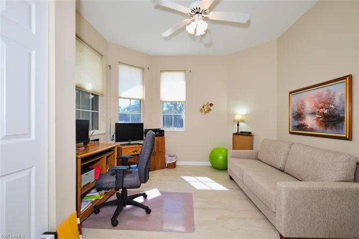 Home office featuring ceiling fan and light wood-style flooring