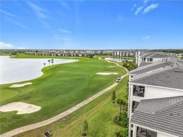Aerial view of a local golf course and a nearby body of water