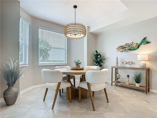 Dining room with a chandelier and baseboards