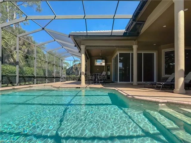 Pool featuring a lanai, a patio area, and ceiling fan