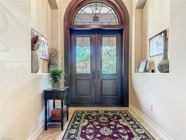 Entryway featuring french doors and baseboards