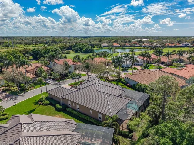 Drone / aerial view with a water view and a residential view