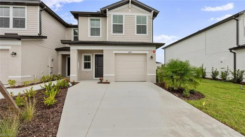 Beautiful front elevation with attached one-car garage.