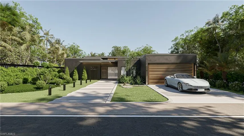 View of front of home with stucco siding, concrete driveway, and an attached garage