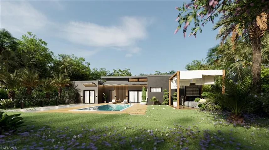 Back of house with stucco siding, a yard, an outdoor pool, and a patio