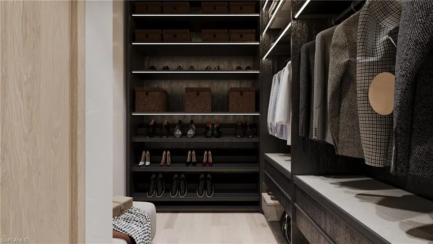 Walk in closet featuring light wood-style floors