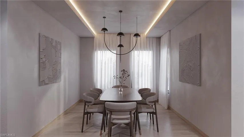 Dining space with light wood-type flooring and baseboards