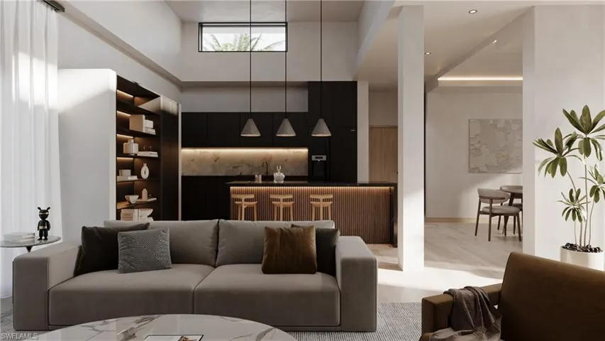 Living area featuring a high ceiling and wet bar