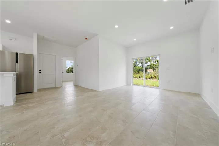 Unfurnished room featuring recessed lighting and plenty of natural light