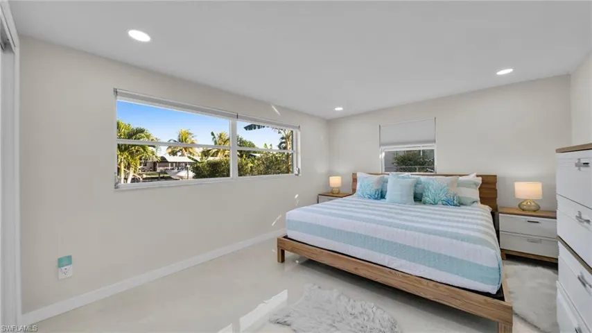 Bedroom with recessed lighting and baseboards