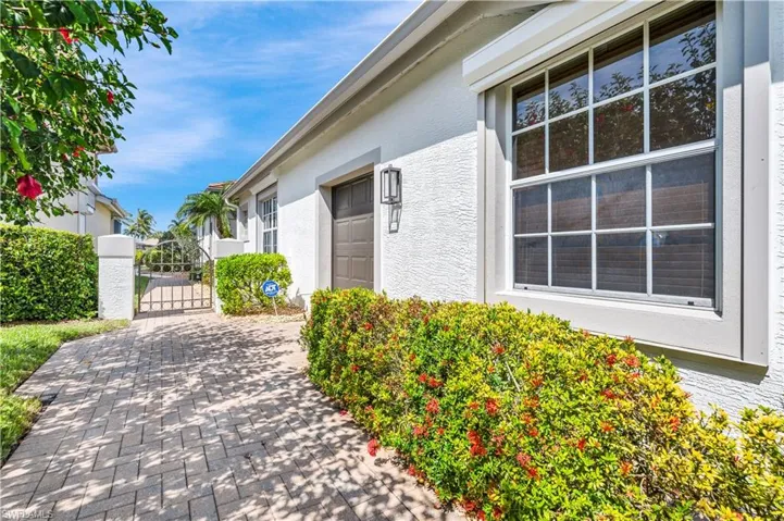 View of side of home with a golf cart garage