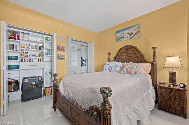 Second bedroom shows the custom closets