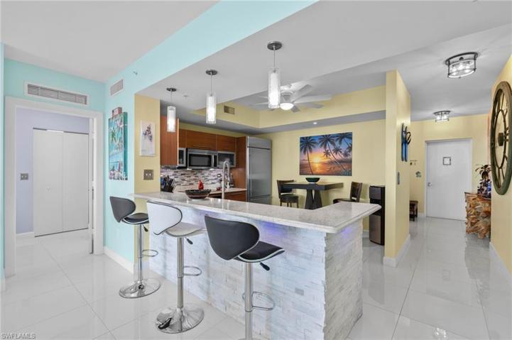 Fantastic upgraded Chefs kitchen. New stone wall, new granite and custom backsplash. And all the new lighting fixtures throughout.