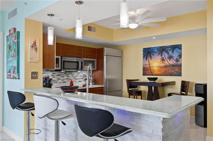 New pendant light fixtures over counter and throughout the condo
