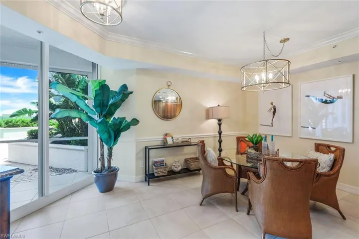 Tiled dining area opens up to private terrace