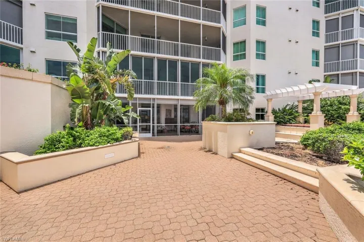 Expansive private terrace featuring a pergola & hot tub