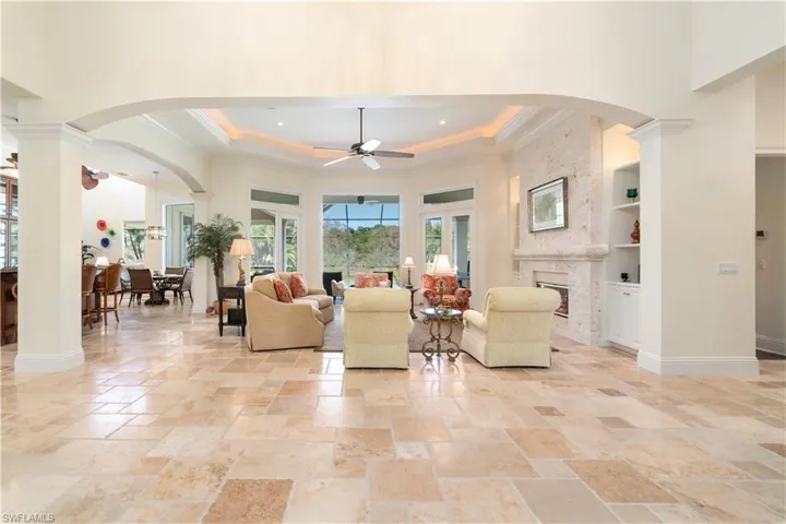 Open and Spacious with lovely saw cut travertine flooring .