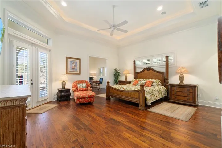 Lovely hardwood floors in the primary bedroom. Second Den is located off the bedroom