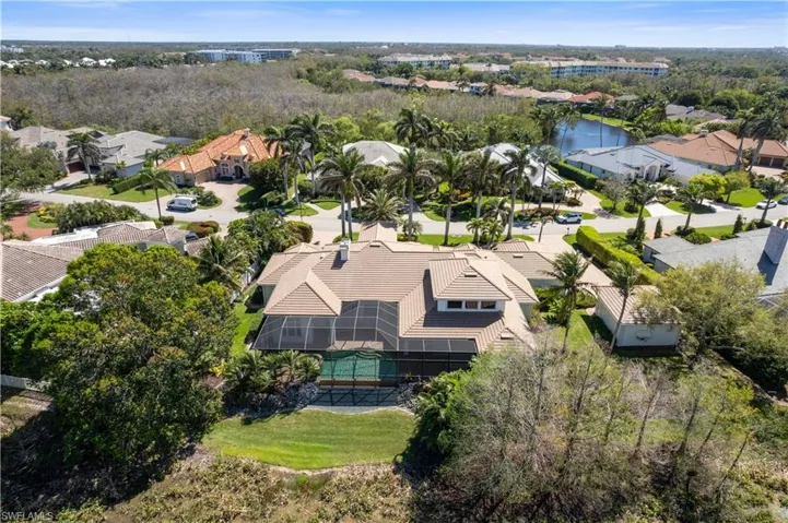 Exterior rear view is a private oasis and the Golf course from afar. Lovely and private