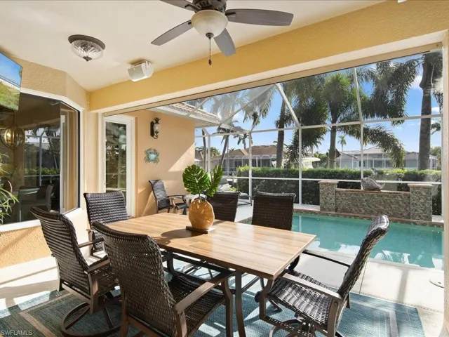 Sunroom / solarium featuring ceiling fan