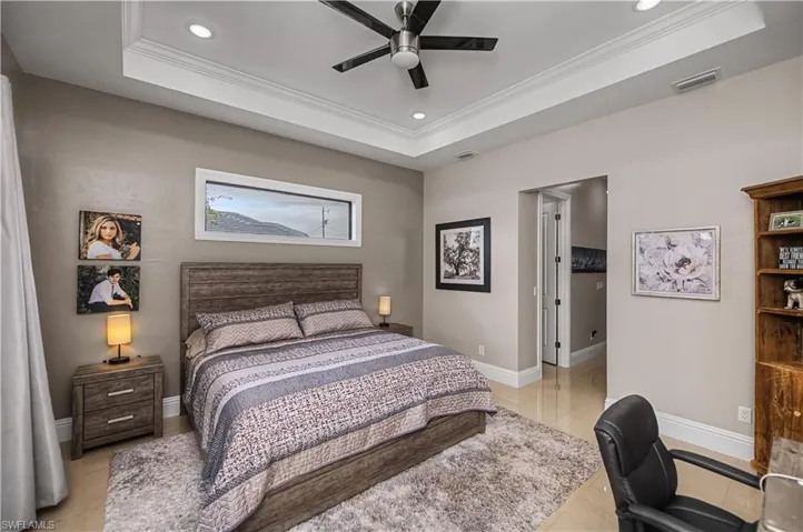 Massive primary bedroom with transom window to allow natural light in