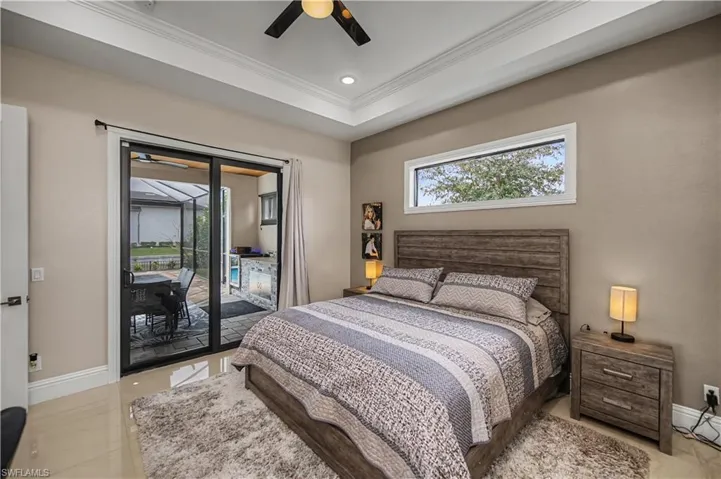 Primary bedroom  with access to lanai multiple and gorgeous crown molding