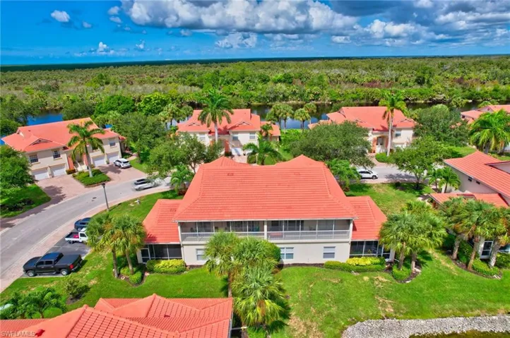 Aerial view of residential area featuring a forest