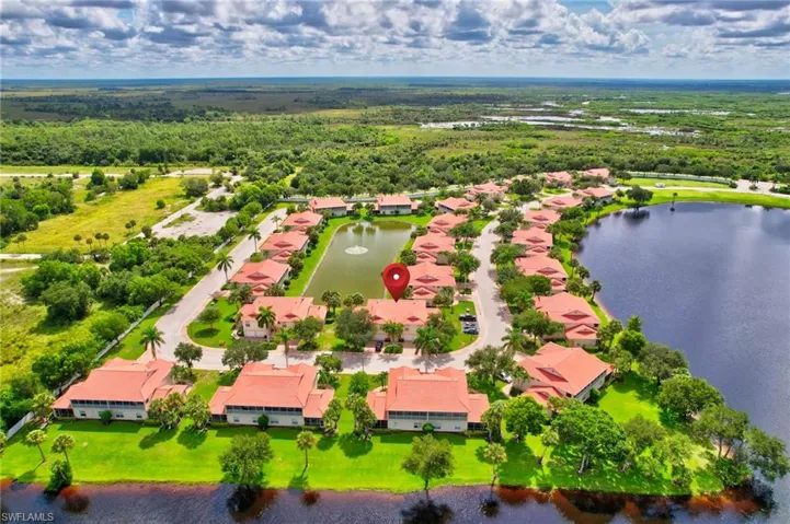 Aerial view of residential area featuring a large body of water